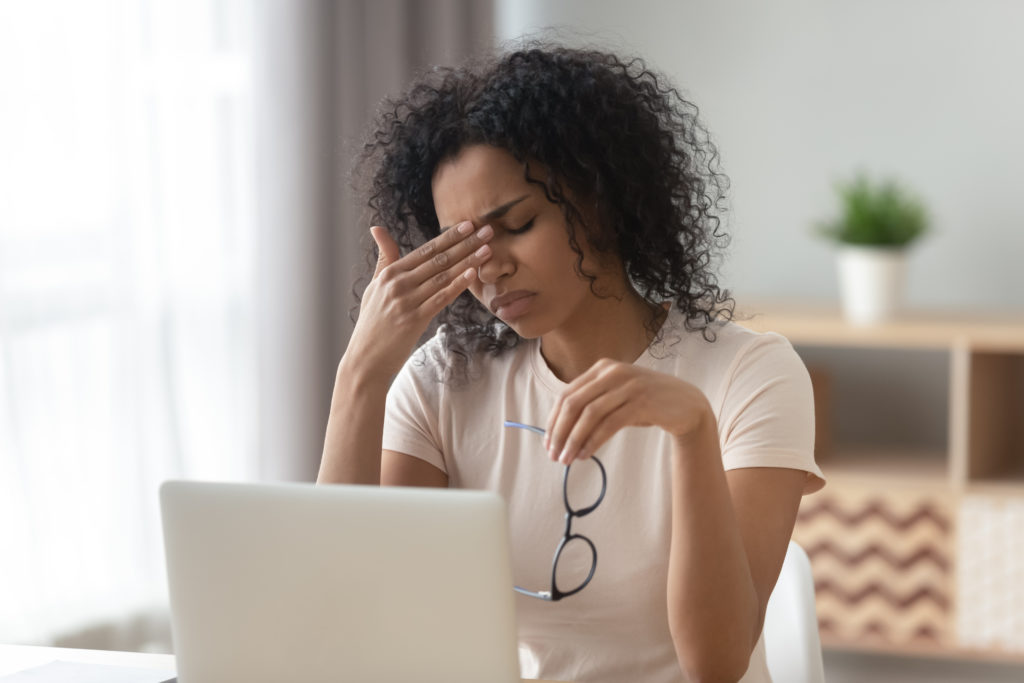 Woman with Eyestrain at a Computer