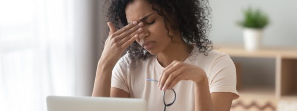 Woman with Eyestrain at a Computer